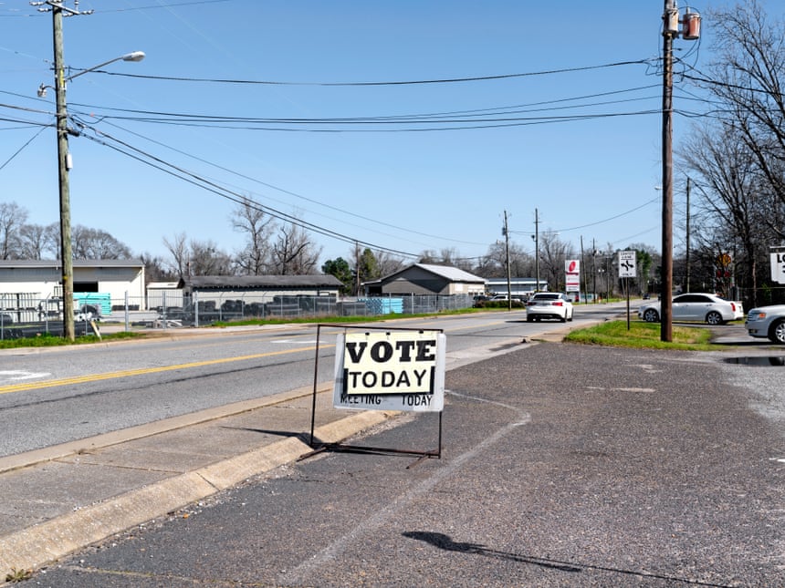 A voting sign near a main street in Tuscaloosa. Photograph: Johnathon Kelso/The Guardian